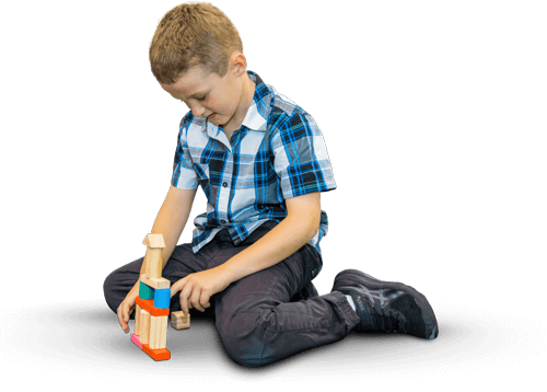 A boy playing with wooden blocks